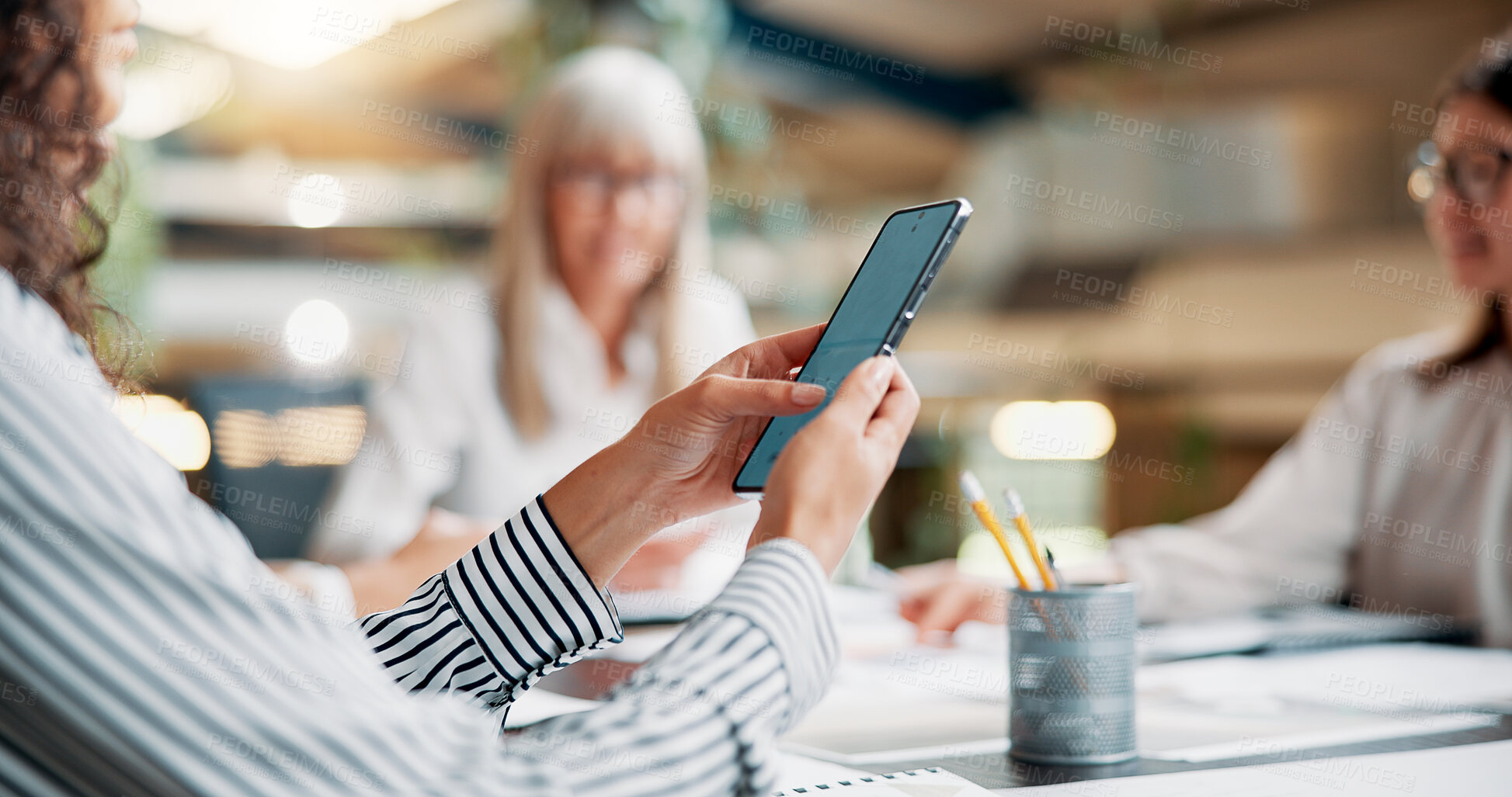 Buy stock photo Business, person and hands with phone in meeting for email marketing, SEO tools or digital collaboration with notification. Creative, check website traffic or social media insight with team in office