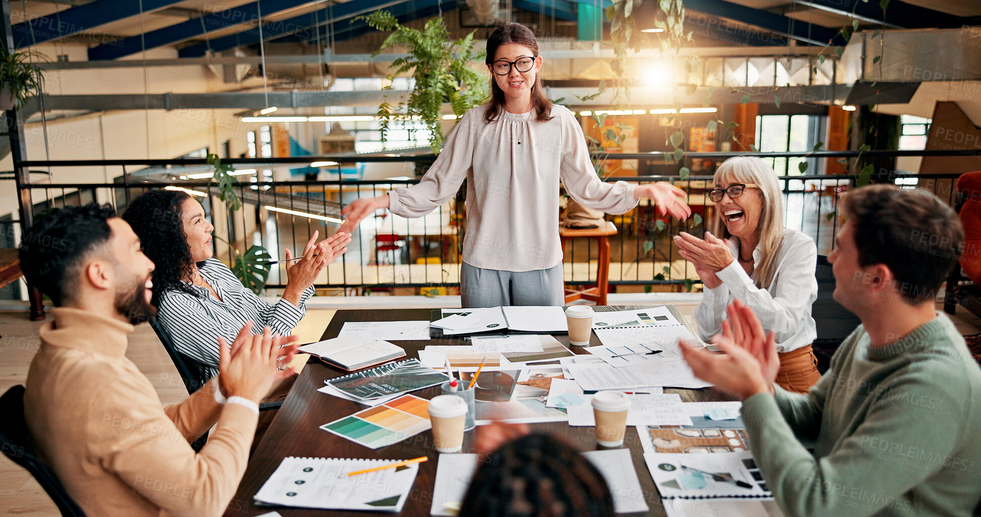 Buy stock photo Creative paperwork, team and applause in meeting for campaign performance, good news and project success. Design agency, above and people with clapping hands for marketing pitch approval and feedback