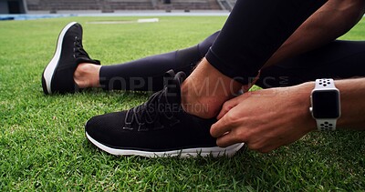 Buy stock photo Fitness, hands and shoes with person on grass in stadium for start of competition or tournament. Exercise, getting ready and sneakers with athlete or runner outdoor on field for sports event closeup