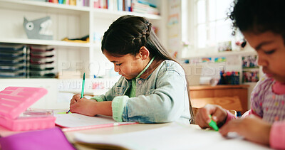 Buy stock photo Education, students and child writing in classroom for learning, fine motor skills and coordination. Development, girls and books at school for assessment, literacy knowledge and academic assignment