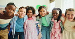 Education, portrait and kids or friends in classroom together for learning, growth or development. Embrace, smile and happy student children in back to school class for knowledge, hug and academics
