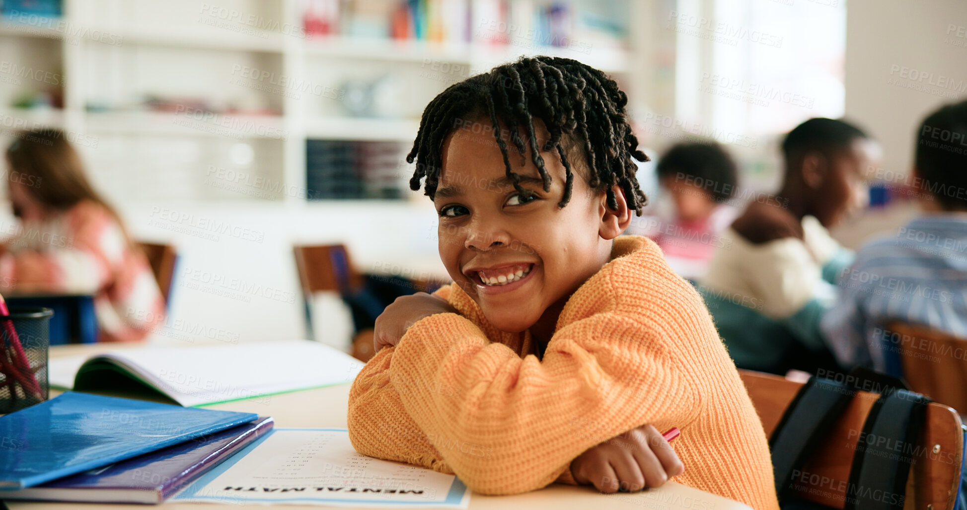 Buy stock photo Boy, arms crossed and portrait in classroom with education, smile and confidence for learning at academy. Kid, happy learner and pupil with paper, math or development with pride at elementary school