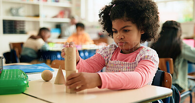 Buy stock photo Girl, child and shapes with block in classroom for studying, knowledge and education for future. Kid, student and puzzle game for scholarship with assignment, learning or development in academy