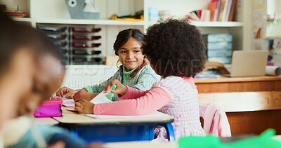 Buy stock photo Learning, students and girls in classroom for knowledge, test and writing exam or study. Kids, talking and team in lesson for education or children for conversation and help together at school