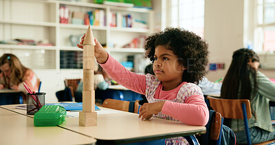 Buy stock photo Girl, child and thinking with blocks in classroom for studying, knowledge and education for future. Kid, student and puzzle game for development with assignment, learning or growth in academy