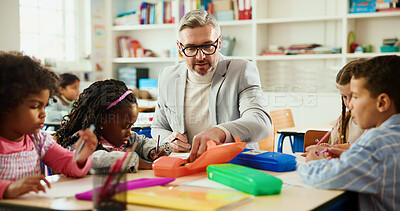 Buy stock photo Education, learning or study with students and teacher at desk in classroom for child development. Future, growth or teaching with educator man and kids in elementary school class for lesson