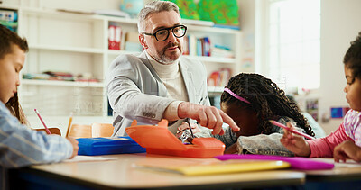 Buy stock photo Future, learning or study with students and teacher at desk in classroom for child development. Education, growth or teaching with educator man and kids in elementary school class for lesson