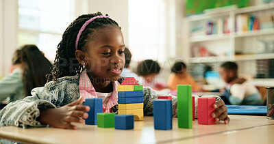 Buy stock photo Girl, smile and building with blocks in classroom, learning and puzzle for problem solving with stack. Happy child, wood toys and development with shapes, solution and thinking at elementary school