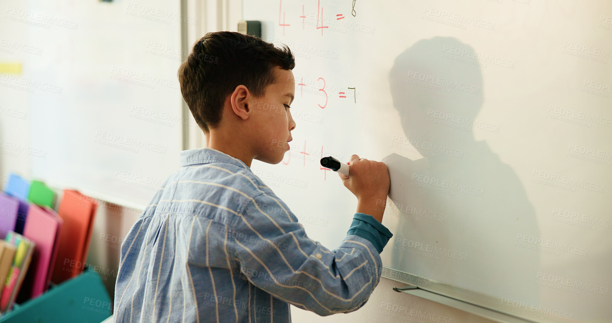 Buy stock photo Whiteboard, education and kid in classroom for learning math, problem solving or knowledge. Elementary school, student and boy child writing for growth, development or presentation at academy.