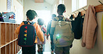 Back, kids and students with backpack in lobby at preschool, education and lunch break. Group, children and boys walking to classroom for learning, group studying and scholarship for knowledge growth