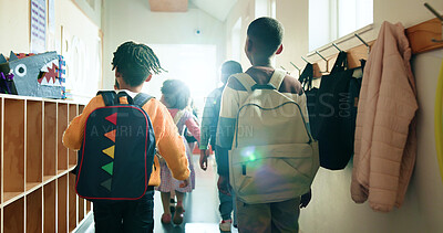 Buy stock photo Back, kids and students with backpack in lobby at school, education and recess break. Pupil, children and boys walking to classroom for learning, group studying and scholarship for knowledge growth