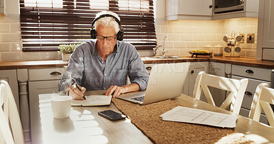 Buy stock photo Senior man, writing or headphones with laptop in home for retirement planning or asset management. Elderly, male person or pensioner with notebook or listening for finance help or investment in house