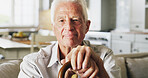 Happy, walking stick and portrait of senior man in home with relax, peace and medical support. Smile, mobility aid and elderly male person with disability, parkinson or arthritis on sofa in house.
