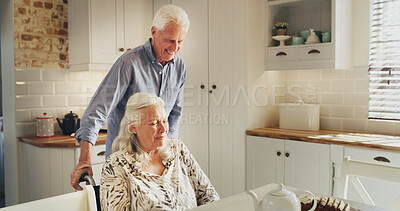 Buy stock photo Food, tea and wheelchair with old couple in kitchen of home together for retirement or wellness. Breakfast, hunger and senior man pushing woman with disability in apartment for start of morning