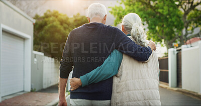 Buy stock photo Senior couple, walking and back with hug in neighborhood for romance, date or outdoor bonding. Elderly, man and woman strolling in street or road with embrace for commitment or retirement together