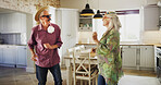 Funny, senior couple and dancing with fashion in kitchen for humor, dressup or cosplay in home. Elderly, man and woman with vibe or energy in costume for retirement comedy or comic in house together