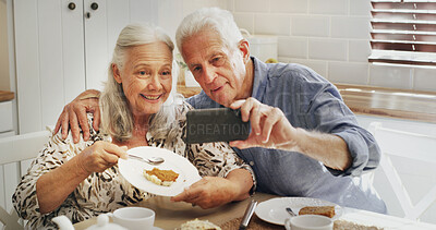 Buy stock photo Old couple, smile and selfie with food, kitchen or bonding with dessert, photo or memory on website. Happy, senior man and profile picture with elderly woman, coffee and people with cake in home