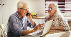 Senior couple, laptop and phone call for finance, mortgage or talking for loan payment. Computer, man and woman on mobile for budget planning, pension savings or retirement expenses in home kitchen