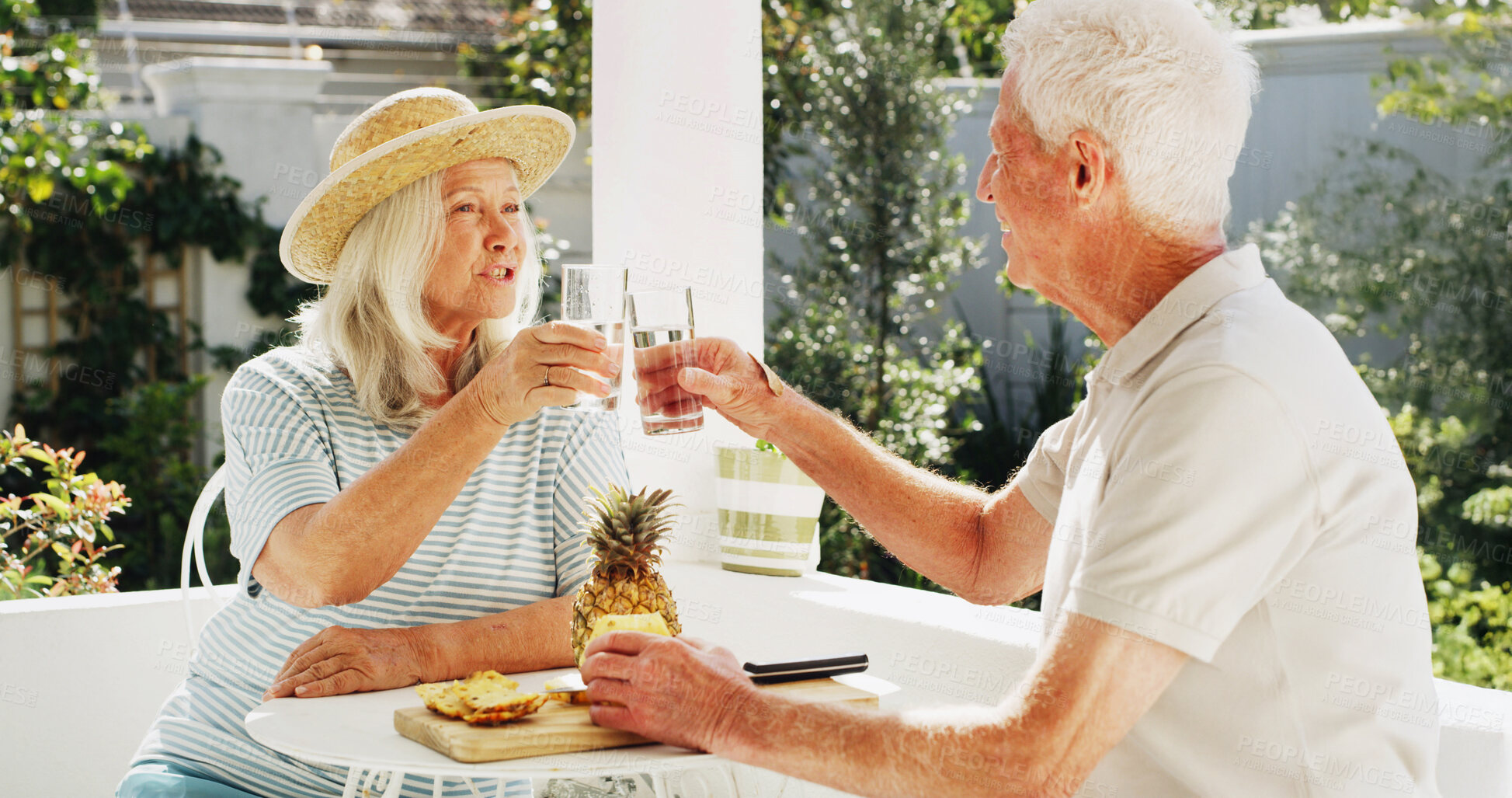 Buy stock photo Happy, elderly couple or toast with glass in backyard for summer bonding, holiday or outdoor weekend. Senior, man and woman with smile or cheers for natural organic drink, diet or mineral liquid