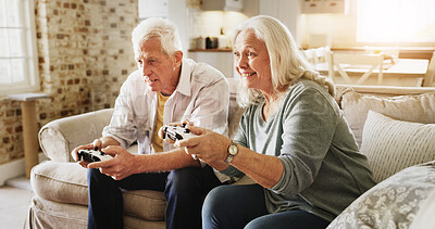 Buy stock photo Home, video game and senior couple on couch, bonding together and controller in lounge. Retirement, love and man with woman, entertainment and competition with hobby, smile and gaming with challenge