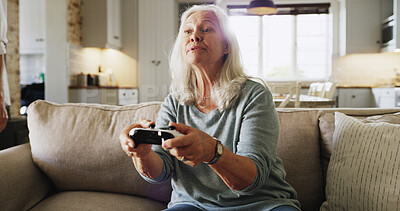 Buy stock photo Elderly, woman and gaming with console controller for video games or online entertainment in home. Senior, female person or gamer with joystick on sofa or couch for subscription or competition