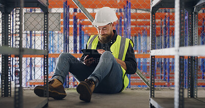 Buy stock photo Schedule, storage and tablet with construction worker man in warehouse for research or update. App, checklist and inspection with person on floor for maintenance, management or manufacturing of depot