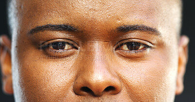 Buy stock photo Serious, man or portrait with eyes in studio for eyesight, vision or optometry on a dark background. Closeup, male person or model looking with face, optic sight or stare for eyecare or perception