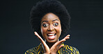 Happy, black woman and portrait with surprise in studio for fashion or style on a dark background. Excited face, female person or African model with smile or afro for shock or expression on space