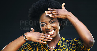Buy stock photo Black woman, portrait and hands with frame in studio for picture on a dark background. Face, female person or African model with smile, afro or creative gesture for style, photography or perspective