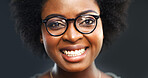 Glasses, portrait and smile of black woman in studio for fitting of prescription frame lenses. Eyewear, optometry and vision with happy African model on dark background for eye exam or ophthalmology