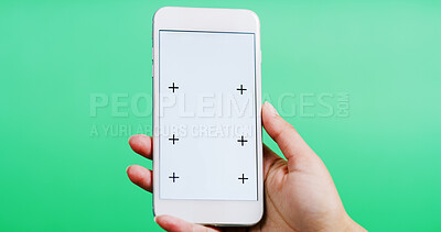 Buy stock photo Person, hands and app with phone screen in studio for online advertising on a green background. Closeup, model or user with mobile smartphone display for digital marketing, UI or UX on mockup space