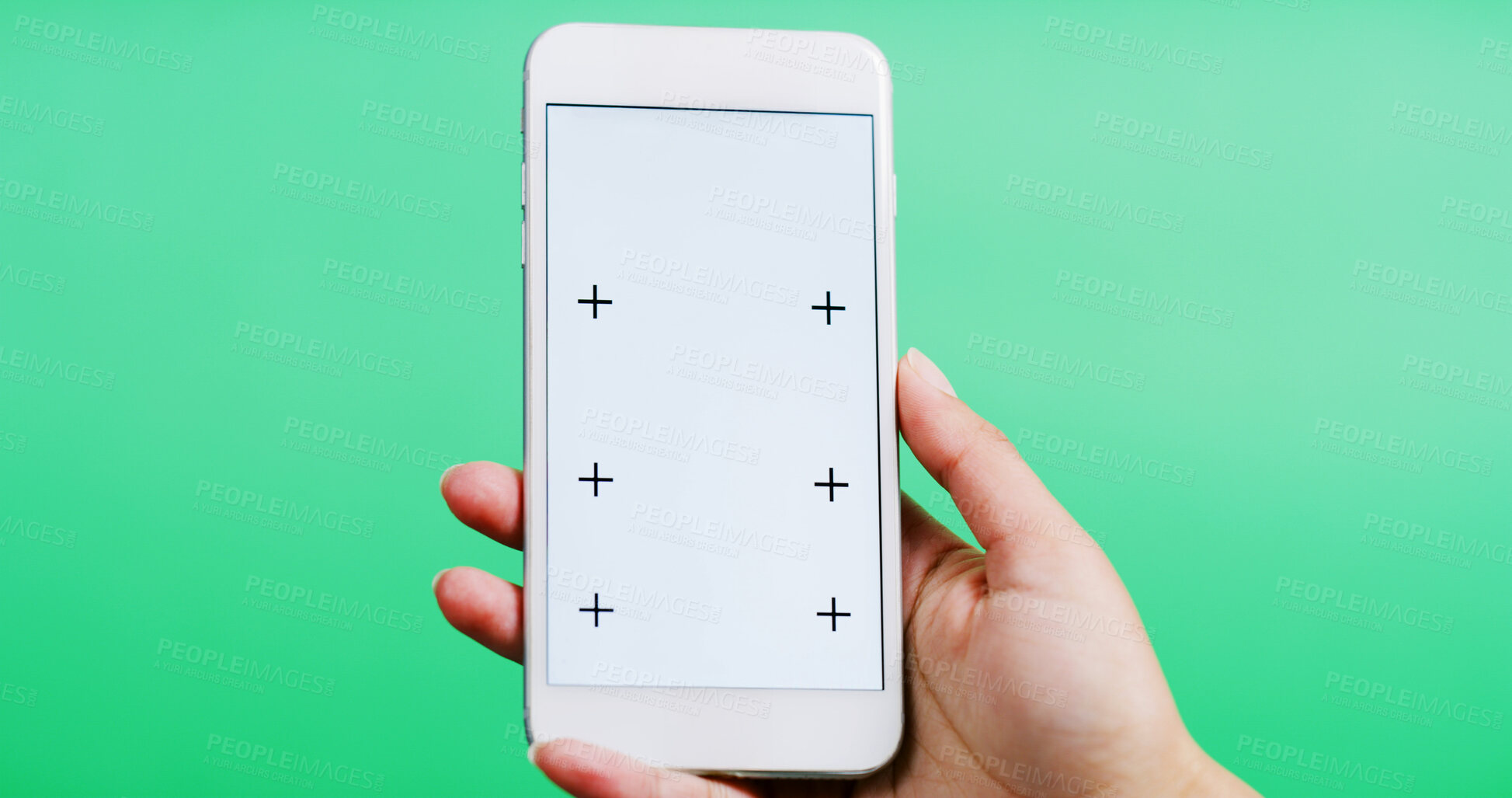 Buy stock photo Person, hands and app with phone screen in studio for online advertising on a green background. Closeup, model or user with mobile smartphone display for digital marketing, UI or UX on mockup space