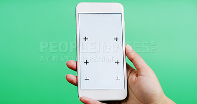 Buy stock photo Person, hands and studio with phone screen for advertising or online app on a green background. Closeup, model or user with mobile smartphone display for digital marketing, UI or UX on mockup space