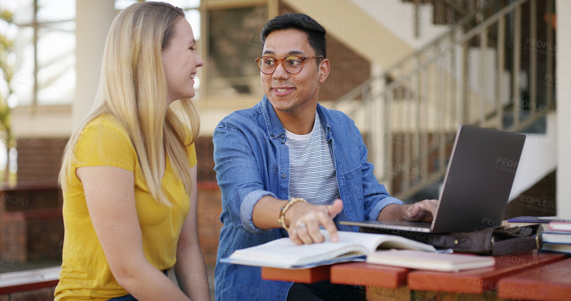 Buy stock photo Students, team and laptop with books outdoor for education, learning and assignment discussion. Studying, man and woman prepare for exam with textbook for knowledge and partner on university campus