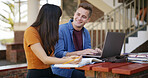 Studying, students and couple with books and laptop on campus for learning, education or exam prep. College, university and woman with man on computer with textbooks for assignment, test or knowledge
