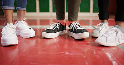 Buy stock photo Feet, school and friends with shoes in hallway for education, learning and knowledge. Lockers, academy and youth development with students on campus for scholarship, studying and support together