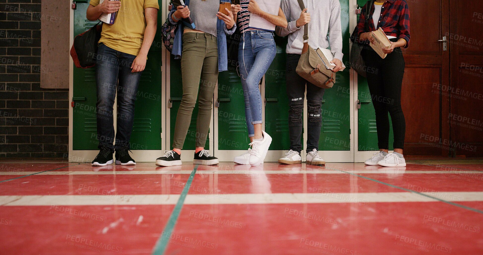 Buy stock photo Legs, group and high school kids in hallway with backpack, tech and floor at locker for education. Friends, feet and book bag with learning, development and scholarship in corridor at academy