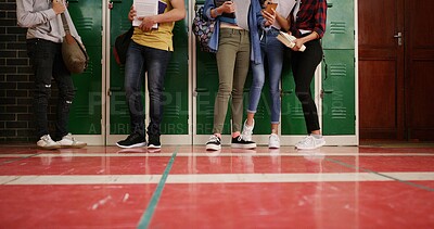 Buy stock photo Legs, group and high school kids in hallway by lockers, tech and floor with backpack for education. Friends, shoes and book bag with learning, development and scholarship in corridor at academy