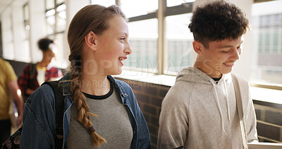 Buy stock photo Talking, students and friends in high school, laughing or humor for story, education or development. Happy, learners and teens with funny joke, girl and conversation with boy, growth and knowledge