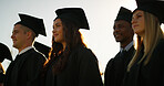 Graduation, students and group with hats, ceremony and celebration of milestone or academic success. University, achievement and people with robes for event, education and complete studies or course