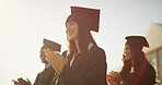 Applause, excited and graduation with students outdoor for celebration, milestone or success. Achievement, education and scholarship with graduate people clapping on college on university campus