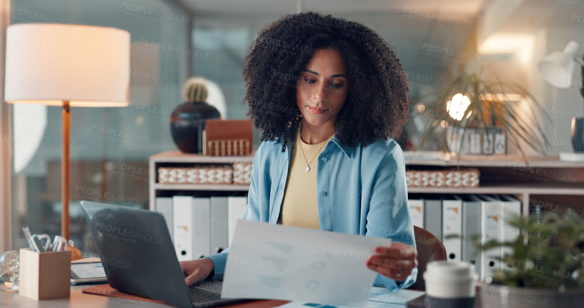 Buy stock photo Reading, document and woman with laptop, office or serious for data entry, online and graph for web. Review, charts and African person with financial report, info and accountant with tech in business