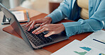 Hands, documents and businesswoman typing on laptop for finance report, data analysis or forecasting. Financial analyst, employee and tech with graphs in office for risk assessment and market trends
