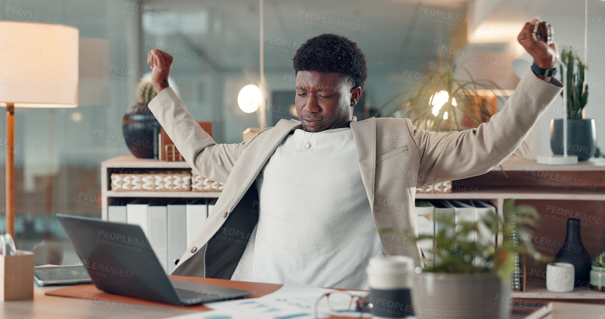 Buy stock photo Tired, night and black man in office, stretching and laptop with fatigue, charts and financial agency. African person, evening or employee in workplace, exhausted or company profit audit with burnout