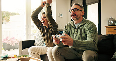Buy stock photo Father, kid and play video game with celebration, win competition and parent with son in home. Happy child, dad and success with console with happiness, victory and bonding together with family