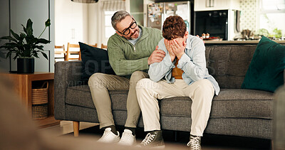 Buy stock photo Comfort, consoling and crying son with father on sofa in living room of home for empathy or support. Emotions, love and sad boy child with single parent man in apartment for trust or understanding