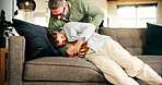 Happy, dad and tickling child in home or playing in living room, family and bonding on break or fun. Laughing, boy and silly on weekend with father, humor and man with affection for son in house