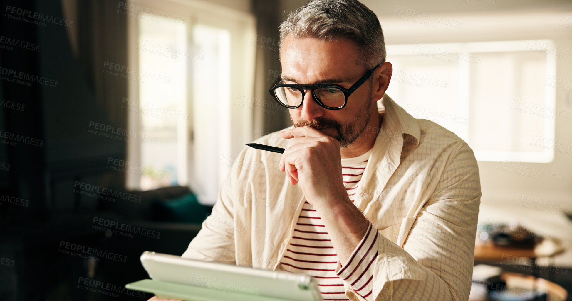 Buy stock photo Remote work from home, thinking and man with tablet, pen and planning for creative project. Artist, entrepreneur and mature person with tech, decision and freelancer with ideas, app and online design
