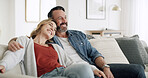 Hug, love and thinking with couple on sofa in living room of home together for break, relax or wellness. Happy, idea and vision with mature people embracing in apartment for bonding or planning