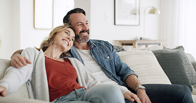Buy stock photo Hug, love and thinking with couple on sofa in living room of home together for break, relax or wellness. Happy, idea and vision with mature people embracing in apartment for bonding or planning